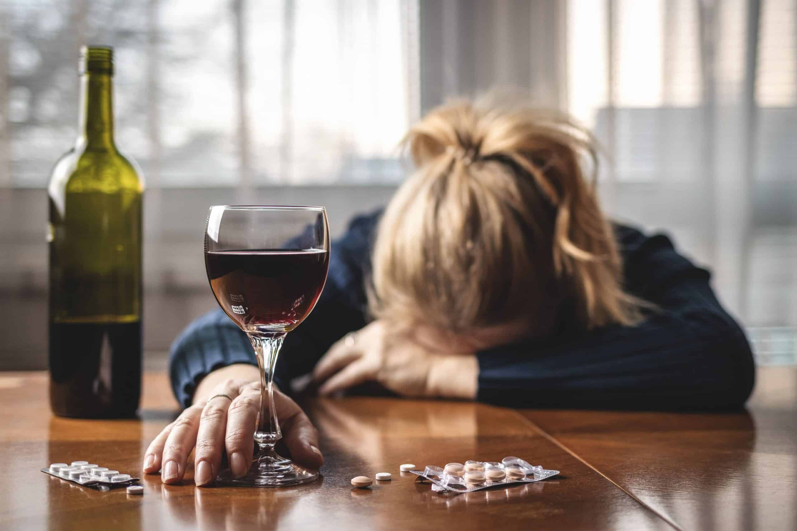 Woman experiencing these dangers of mixing alcohol and benzos